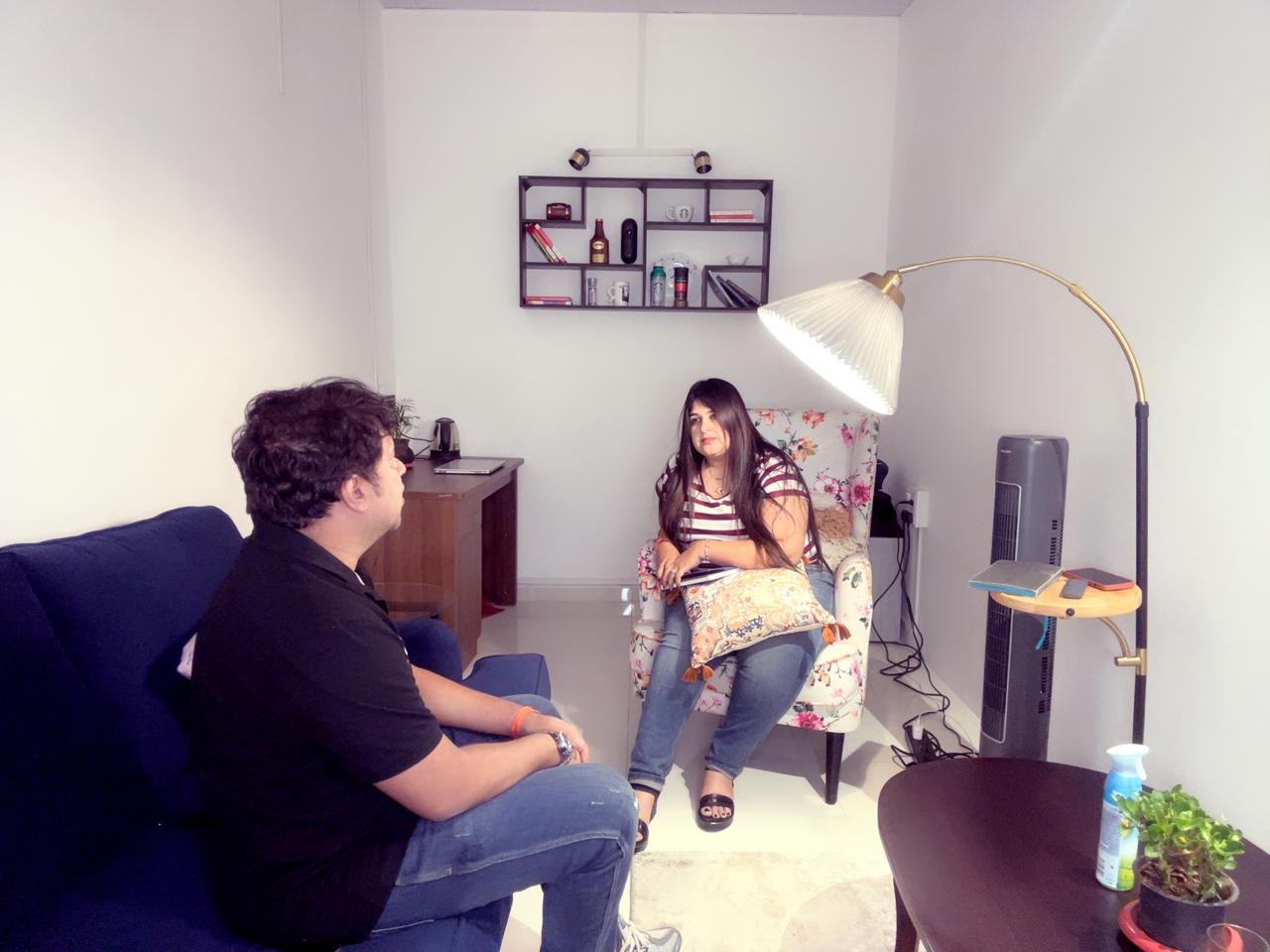 Behavioral health clinician meeting with a client during a therapy session