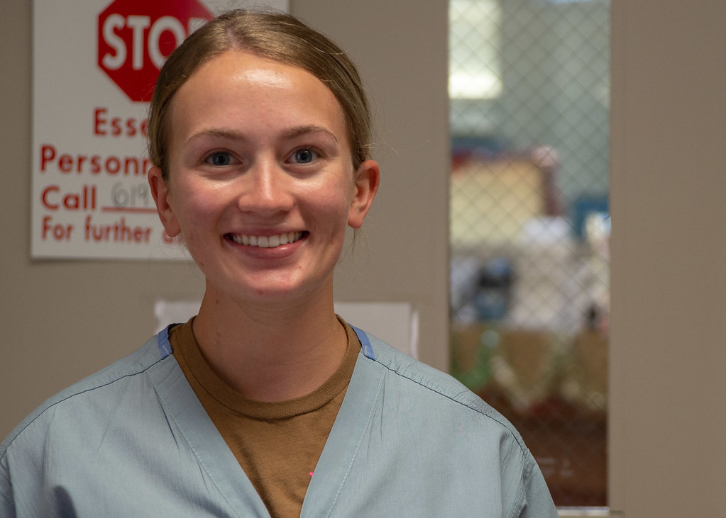 Registered nurse in scrubs at a Sacramento healthcare facility, illustrating the travel nurse vs. per diem staffing decision